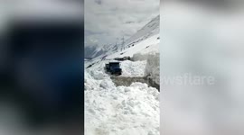 Avalanche takes place in northern India, nearly burying a vehicle in snow