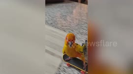Pet sun conure parrot rides skateboard down homemade ramp