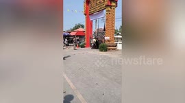 Frenzied devotees break down temple gates while queueing to buy blessed amulets
