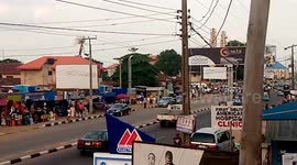 Road Busy with Keke,cars,and people