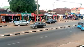 Road Busy with Keke,cars,and people