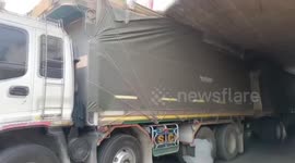 Ten-wheeler stuck in underpass after bungling driver misjudges vertical clearance