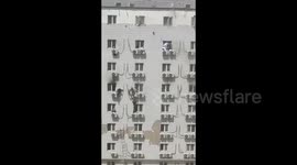 Terrifying scene as doctors escape deadly fire in China by climbing out hospital windows