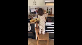 Talented 4 y/o girl performing her weekly ritual of making pancakes for family