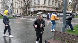 Ukrainians pour water on each other during Easter Monday in Lviv, Ukraine