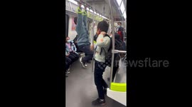 Naughty boy falls from handlebar while playing gymnastics on train in China