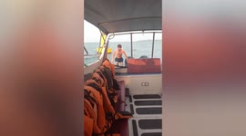 Bizarre moment British tourist is rescued clinging to buoy after going for 'morning swim' off Thai coast