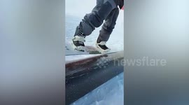Skier plunges face-first into snow while sliding down rail in Italy