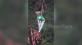 Athlete walks across rope over mountain in amazing slacklining stunt in Brazil