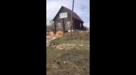 Coastal erosion sees house collapse into river in western Russia