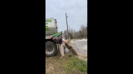 You won't believe this s***! Watch hilarious moment waste workers have fun with sludge-filled dump