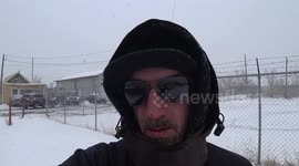 Man records as he trudges through ankle-deep snow in Regina, Canada
