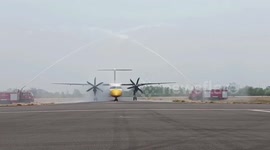 Airport staff give water salute to mark Nok Air's last flight with a Bombardier Dash 8