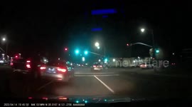 Close Call: Vehicle Nearly Gets Clipped By a Grey Car Driving Recklessly Through Traffic