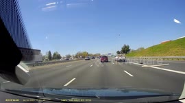 WTF Moment: Unsecure Wood Plank Flies Out The Back of a Truck Onto a Active Highway