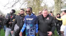 Crowds in London’s Hyde Park for 420 think this guy with an entourage is Snoop Dogg