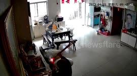 Elderly Chinese woman mistakes fireworks for incense during religious ritual