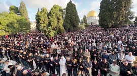 Palestinians attend Eid al-Fitr prayer at al-Aqsa mosque in Jerusalem