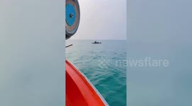 Tourist floating on palm frond raft rescued by marines off Thai island