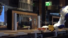 Dancing samurai robot serves customers at Japanese restaurant