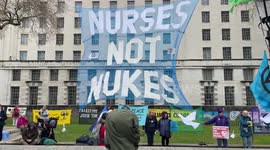 Giant banner 'Nurses Not Nukes' at the Extinction Rebellion protest opposite Downing Street, London