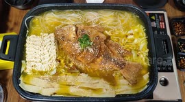 Fish steamboat with whole fish in pot