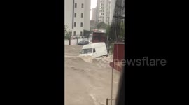 Vehicles part-submerged after torrential rains hit Adana in southern Turkey