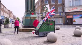 Pensioner flies flag for St. George's Day from customised mobility scooter in Kent, UK
