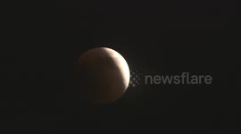 Multiple time lapses of full Blood Moon as it approaches full lunar eclipse with earthshine
