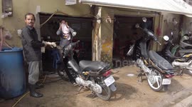 Locals use motorcycle hand wash in Cambodia