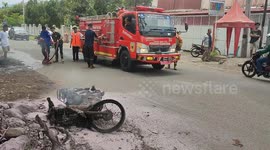 Fire fighters Extinguis A Burning Motorcycle In Indonesia, On April 23, 2023.