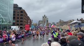 Thousands of runners cross Tower Bridge as the London Marathon kicks off