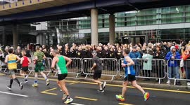 London Marathon: The Rock Choir cheers up runners in Canary Wharf