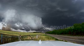 Watch these storm chasers quickly drive away from menacing-looking system