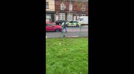 Amusing scene as boy, 12, leaps into police car to honk horn as officers make arrest in Birmingham