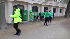 Green colours of Team NSPCC enclosure at The Mall Galleries during 2023 TCS London Marathon