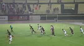 Tropical storm lashes football game amid record heat wave in Asia