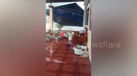 Storm batters home as heat wave gives way to heavy rain in Thailand