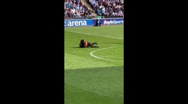 Watch moment steward brutally rugby-tackles pitch invader at Coventry City match - to massive cheers from crowd