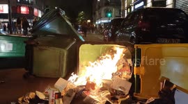 Trash cans set on fire and riot police deployed in latest Paris pension protests