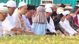 Keep your beloved child safe, hug them so they don't run out into the street during Eid al-Fitr prayers