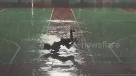 Chinese dancer performs stunning street dance in heavy rain