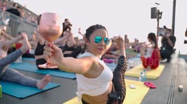 Fitness enthusiasts hold lively yoga class on top of tallest building in Thailand