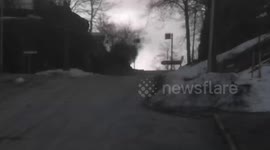 Daredevil skateboarder slams while rolling down steep road