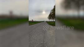 Motocross rider tumbles across road after wheelie fail in Italy