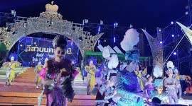 Performers in elaborate, glittering costumes on stage at an Isaan Mor Lam concert in Pattaya, Thailand