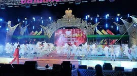 Performers in elaborate costumes perform on stage at an Isaan Mor Lam concert in Pattaya, Thailand