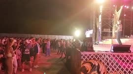 A singer performs at an Isaan Mor Lam concert in Pattaya, Thailand