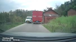 Dashcam video records van crashing into house roof, causing damage in China