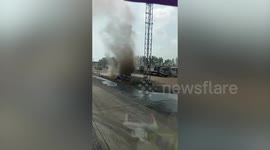 Enormous dust devil blocks oncoming cars in Thailand